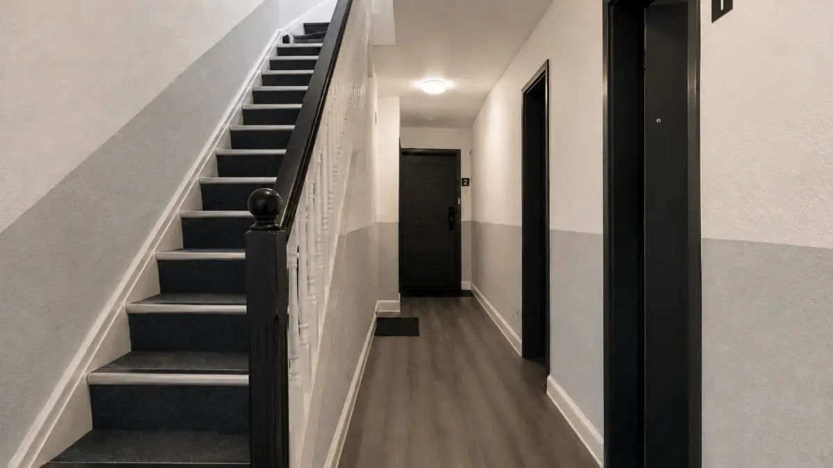 Cleaner mopping a shared stairwell in an HMO building
